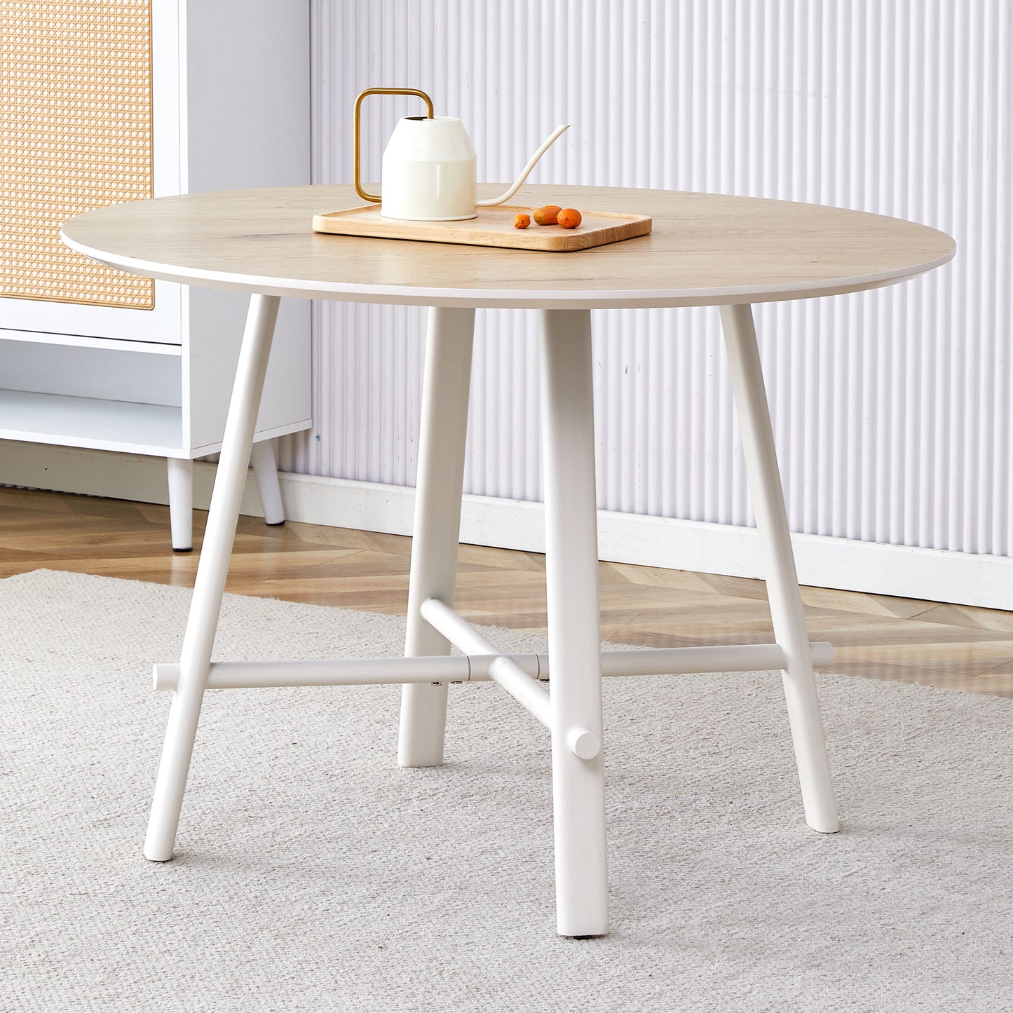 A modern and minimalist circular dining table with a 42 inch diameter wood colorer patterned tabletop and white metal legs. Suitable for restaurants, living rooms, and conference rooms.