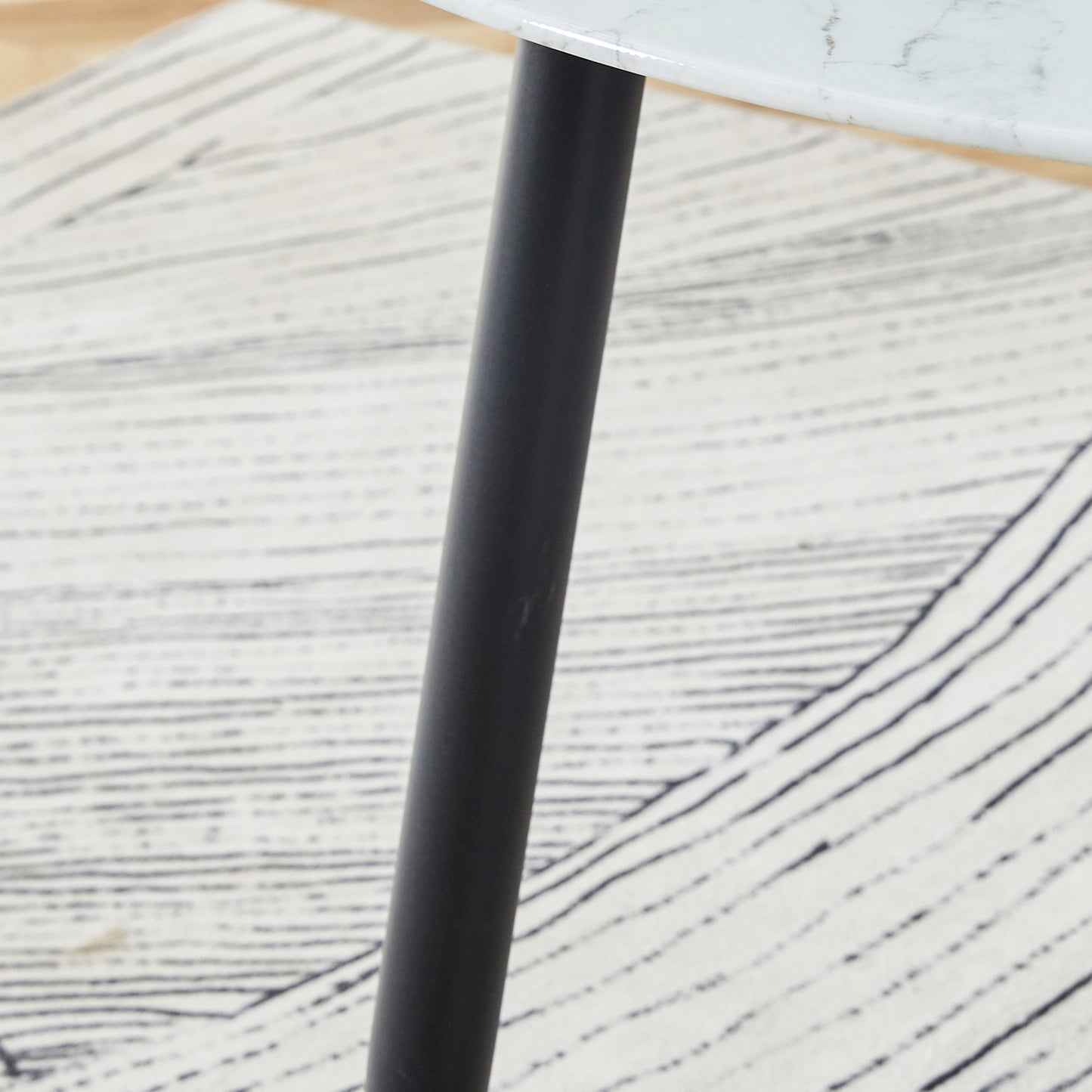 A modern minimalist circular dining table with a diameter of 40 inches, a 0.3 inch thick imitation marble pattern tabletop and black metal legs  40 '* 40' * 30 'DT-1164