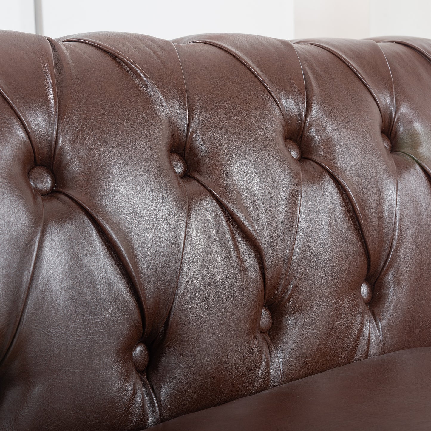 84.65" Dark Brown PU Rolled Arm Chesterfield Three Seater Sofa.