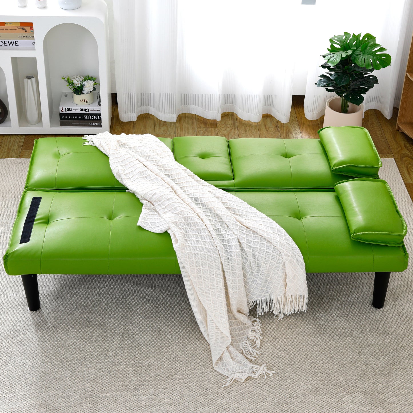 The 67-inch green PVC multi-functional sofa bed, with a foldable and cup holder design, makes it extremely convenient to turn the living room into a guest room