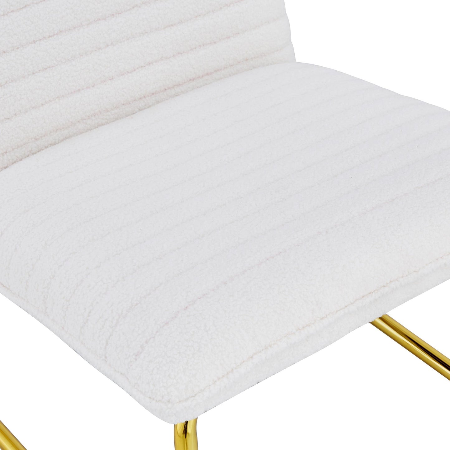 One White minimalist armless sofa chair with plush cushion and backrest paired with golden metal legs, suitable for offices, restaurants, kitchens, bedrooms