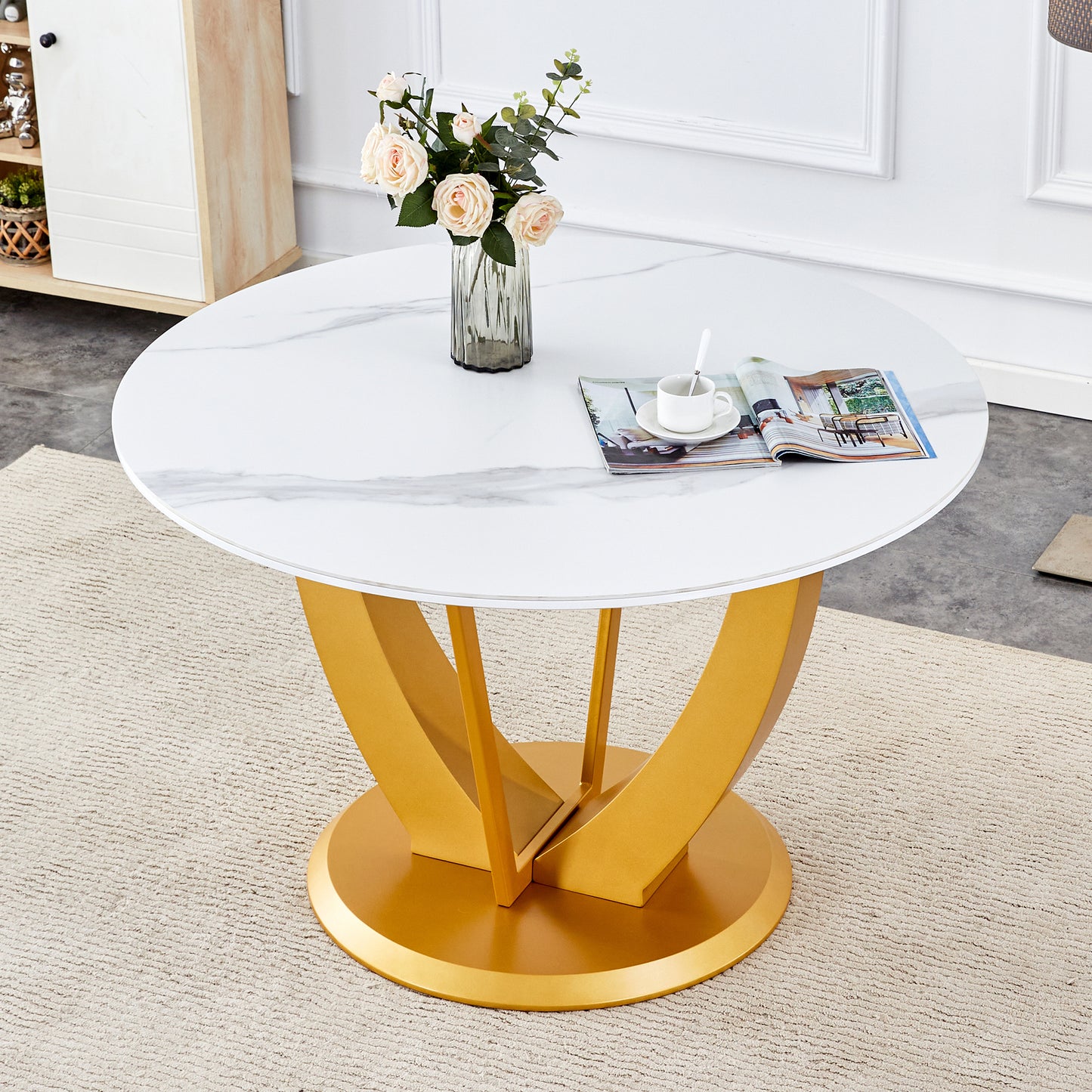 A modern minimalist round white patterned table top measuring 48 inches in diameter with gold MDF legs. Suitable for dining and living rooms.