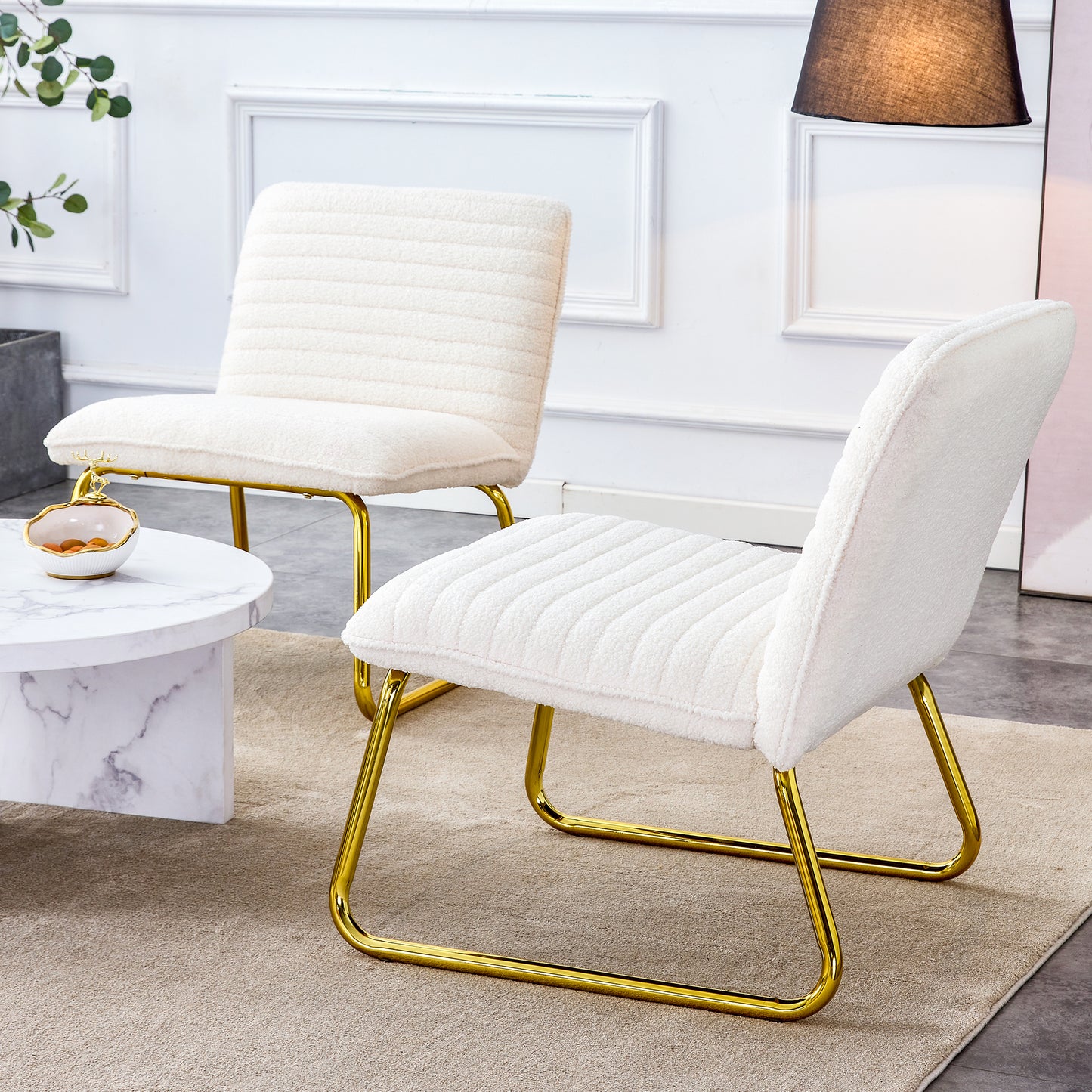 One White minimalist armless sofa chair with plush cushion and backrest paired with golden metal legs, suitable for offices, restaurants, kitchens, bedrooms